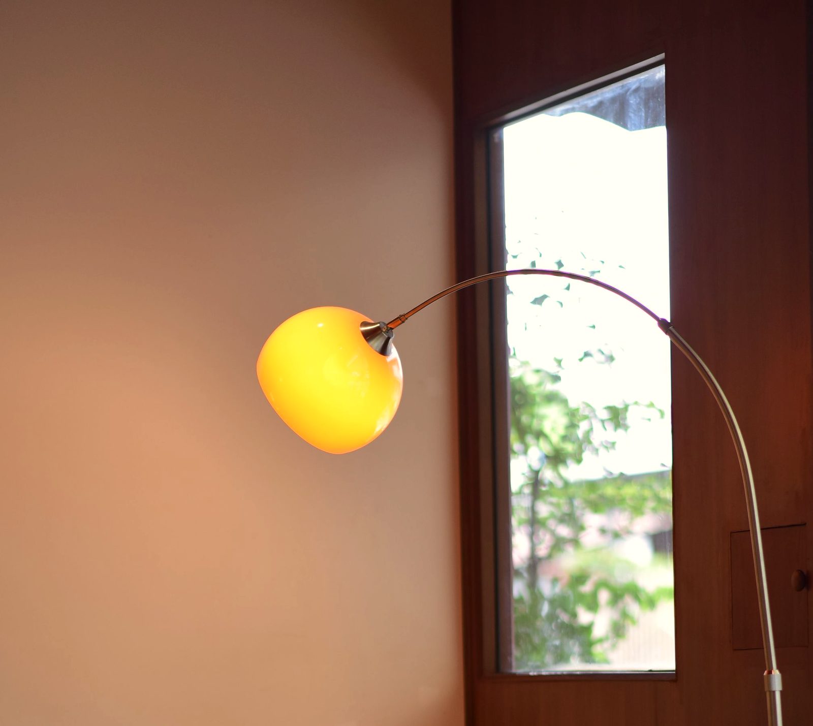 A cozy indoor setting with modern furniture and a warm floor lamp. Perfect for lifestyle or interior design themes.